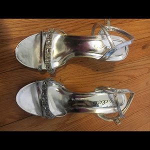 Metallic silver high heeled shoes